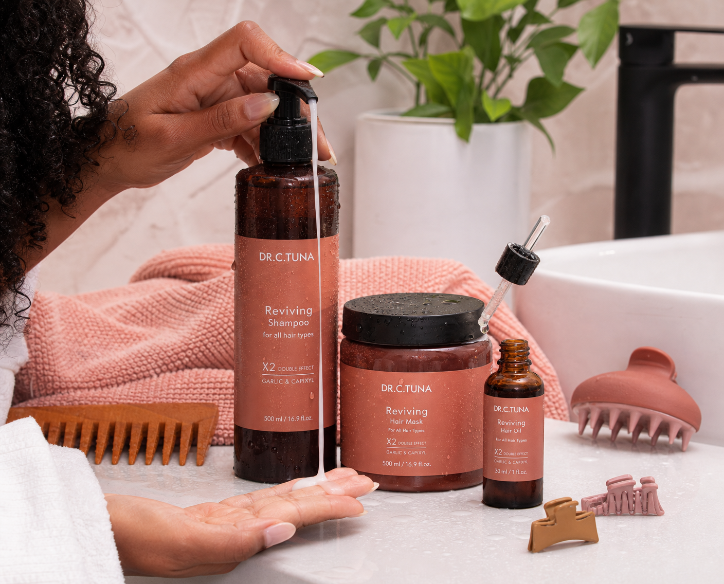 Dr. C. Tuna Reviving Shampoo, Hair Oil and Hair Mask styled with roses